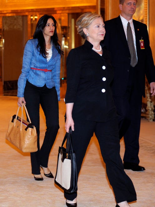 Abedin and then-secretary of State Hillary Clinton walk to a meeting with Abu Dhabi Crown Prince Sheik Mohammed bin Zayed Al Nahyan at the Emirates Palace Hotel in Abu Dhabi, United Arab Emirates, on June 9, 2011.