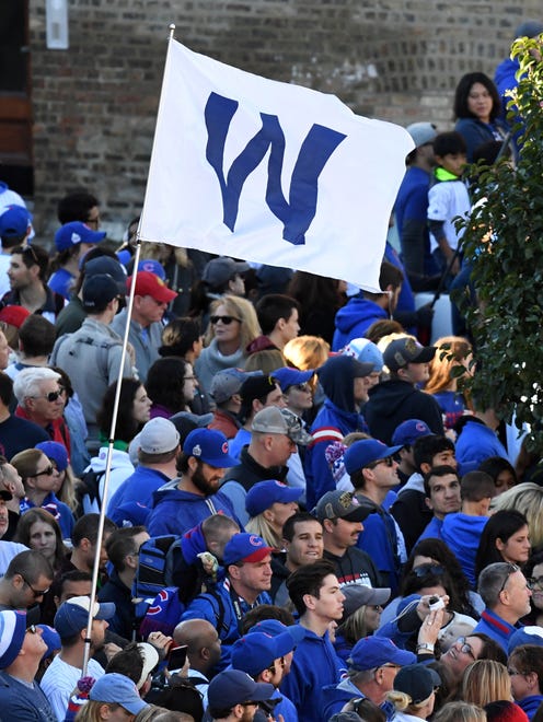 Fans celebrate outside Wrigley Field during the parade.