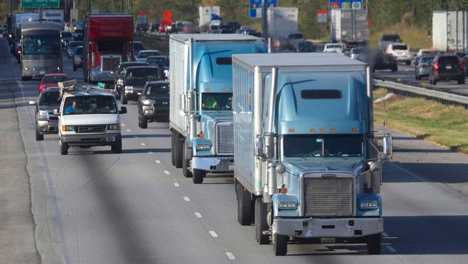 Trucks travel along Interstate 75 near Stockbridge,