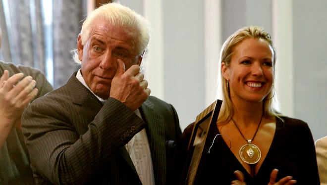 Professional wrestler Ric Flair cries as he is recognized for his career and community service accomplishments after he received a key to the city from Columbia (S.C.) Mayor Bob Coble in 2008.