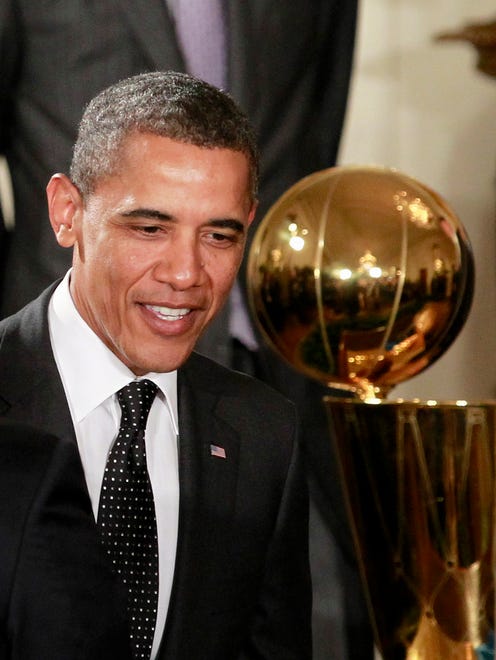 President Barack Obama greets guests in the East Room of the White House in Washington, Monday, Jan. 9, 2012, after a ceremony honoring the 2011 NBA champion Dallas Mavericks.