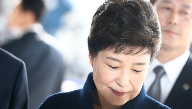 Impeached South Korean former President Park Geun-hye arrives to the Seoul Central District Prosecution Office for questioning in Seoul, South Korea, March 21, 2017.