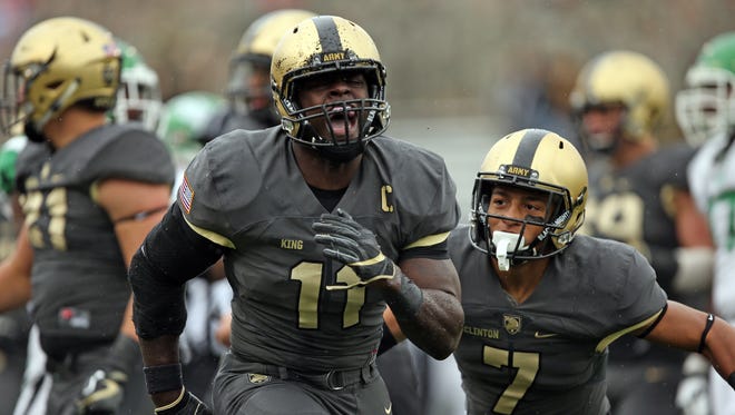 Army Black Knights linebacker Andrew King (11) reacts after a defensive stop against the North Texas Mean Green during the first half at Michie Stadium.