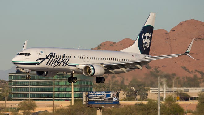An Alaska Airlines Boeing 737 lands in Phoenix Sky Harbor International Airport on February 2, 2015.