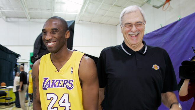 2006: Jackson and Kobe Bryant share a laugh as they walk to a photo shoot during Lakers media day.
