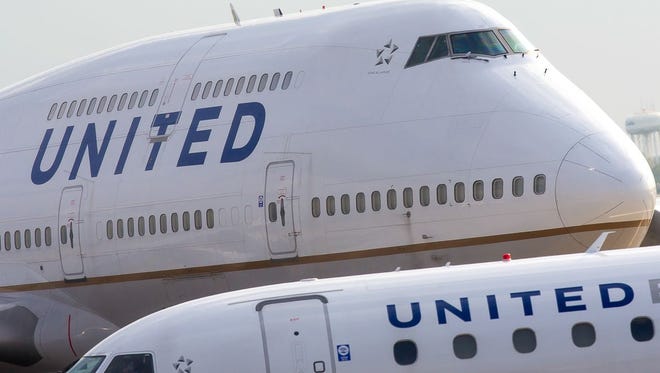 United Airlines jets taxi through Chicago O'Hare International Airport in April 2016.