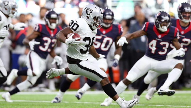 Oakland Raiders running back Jalen Richard (30) returns a punt in the first quarter against the Houston Texans in the AFC Wild Card playoff football game at NRG Stadium.