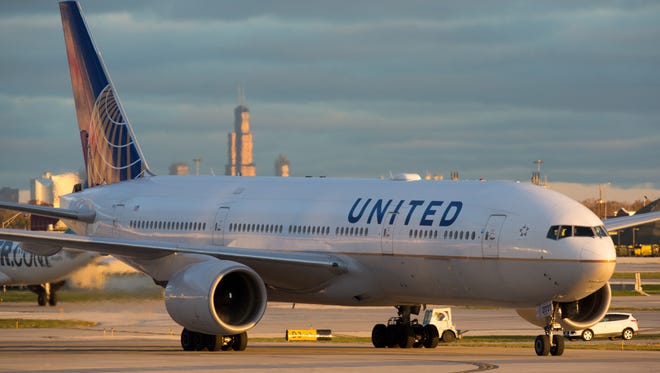 A United Airlines Boeing 777-200 taxies for departure from Chicago O'Hare International Airport in November 2016.