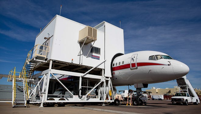 Honeywell's unique Boeing 757 test bed airplane under the desert sun at Phoenix Sky Harbor International Airport on Feb. 2, 2015. The large housing covering it is used to monitor, repair, and swap test engines that the company is producing.