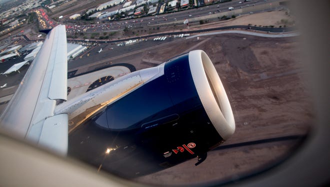 A US Airways Airbus A321 jet climbs out of Phoenix Sky Harbor Airport on Feb. 2, 2015.