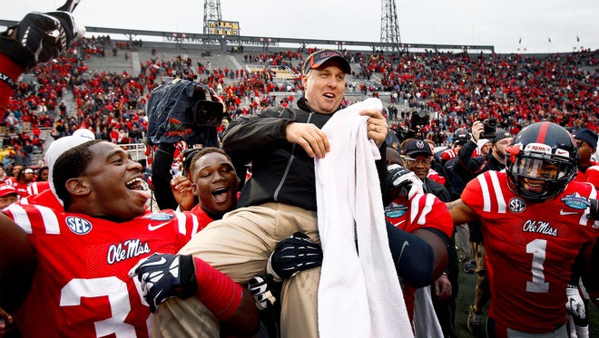 January 5, 2013 - Ole Miss head coach Hugh Freeze (top) is carried off the field by his players after defeating Pittsburgh 38-17 in the BBVA Compass Bowl game in Birmingham, Al. (Mark Weber/The Commercial Appeal)
