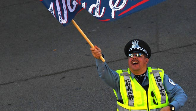 A Chicago police officer celebrates with fans during the parade.