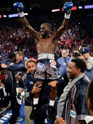 Terence Crawford celebrates his victory over Julius Indongo.