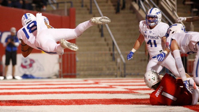 Air Force defensive back Brodie Hicks (18) intercepts a pass in the end zone against Fresno State.