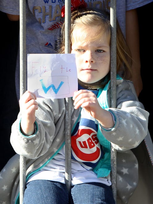 A young fan holds a sign during the parade.