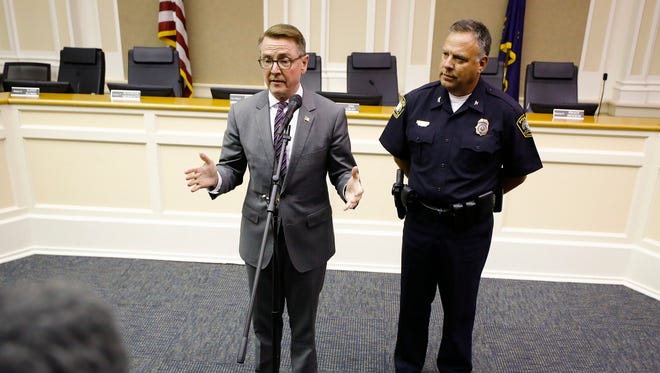 Lexington Mayor Jim Gray, left, speaks to the media along side Lexington Police Chief Mark Barnard following a vote on a proposal to move two Confederate-era statues from downtown Lexington at the Lexington-Fayette Urban County Government Center in Lexington, Ky., Tuesday, Aug. 15, 2017. The council voted 15-0 to pass the resolution. (Alex Slitz/Lexington Herald-Leader via AP)