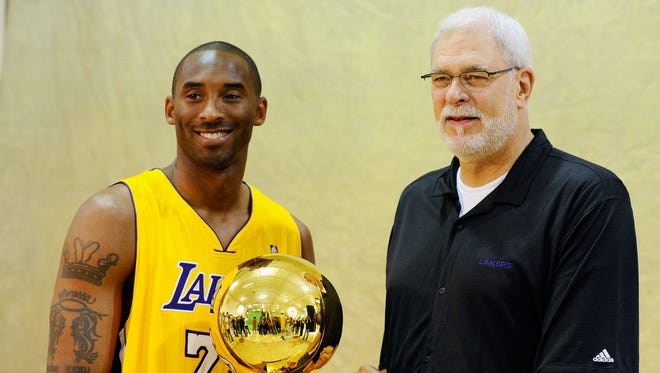 2010: Kobe Bryant and Jackson of the Los Angeles Lakers pose with the Larry O'Brien Trophy.