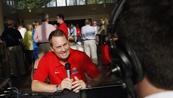 April 30, 2012 - Ole Miss football coach Hugh Freeze does a radio interview at the Memphis Botanic Gardens on a recent trip to mingle with Ole Miss supporters on the last stop of the week long bus tour called the Rebel Road Trip.