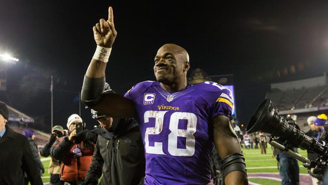 Minnesota Vikings running back Adrian Peterson (28) acknowledges the fans following the game against the New York Giants at TCF Bank Stadium.