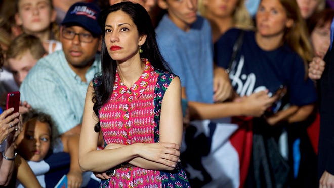 Abedin waits while the Clinton greets supporters after holding a rally with Vice President Biden at Riverfront Sports athletic facility on Aug. 15, 2016, in Scranton, Pa.