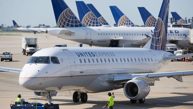A United Express Embraer E170 jet prepares for departure from Chicago O'Hare International Airport in June 2015.