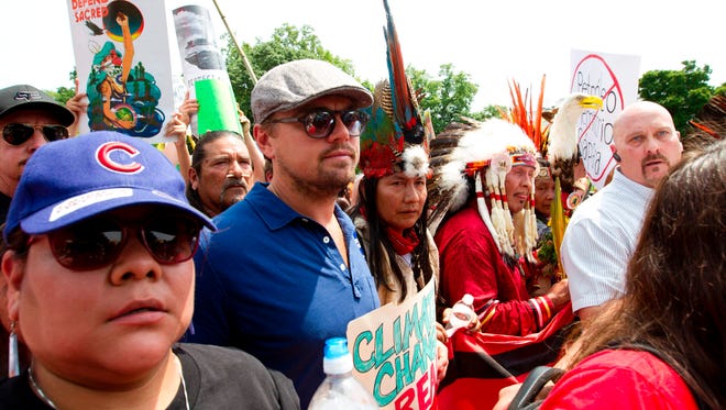 Actor Leonardo DiCaprio marches with a group of indigenous people from North and South America during the Peoples Climate March in Washington DC, on Saturday.
