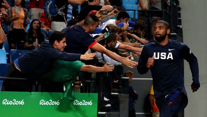 United States guard Kyrie Irving (10) runs to the court before the game against China in the men's basketball group A  preliminary round during the Rio 2016 Summer Olympic Games at Carioca Arena 1.