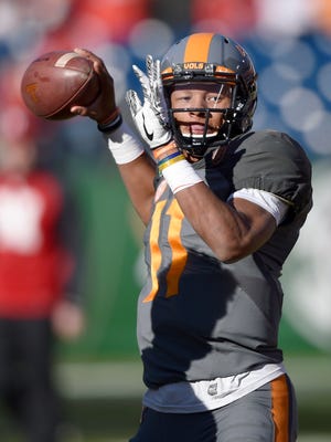 Tennessee Volunteers quarterback Joshua Dobbs (11) warms up before the Franklin American Mortgage Music City Bowl at Nissan Stadium in Nashville on Dec. 30, 2016.