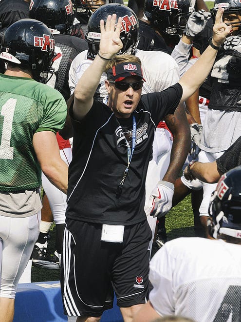 In this photo taken March 29, 2011, Arkansas State head football coach Hugh Freeze calls drills during NCAA college football practice in Jonesboro, Ark. Freeze has made the most of his notoriety as Michael Oher's high school coach in the book and film "The Blind Side." And he's not afraid to use that as he tries to build the Red Wolves into a Sun Belt Conference contender.  (AP Photo/The Jonesboro Sun, Graycen Colbert)