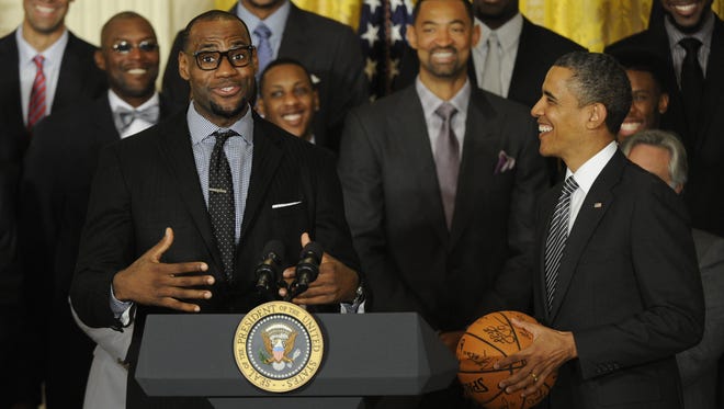 LeBron James expressing emotion about being at the White House while presenting a team signed basketball to President Barack Obama.