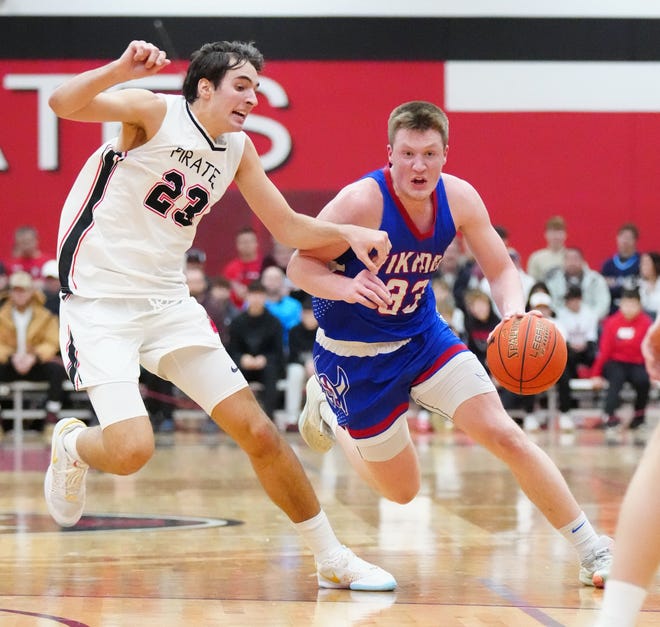Wisconsin Lutheran's Kon Knueppel (33) breaks for the paint with Pewaukee's Luka Momcilovic (23) defending at Pewaukee, Friday, Feb. 9, 2024.