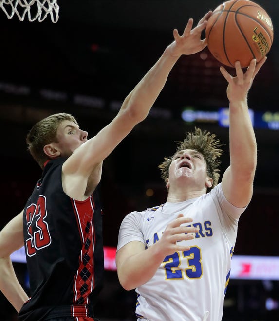 Marathon High School's Grant Warren (33) against Kenosha St. Joseph Catholic Academy's Dominic Santarelli (23) in a Division 4 semifinal game during the WIAA state boys basketball tournament on Thursday, March 14, 2024 at the Kohl Center in Madison, Wis. Kenosha St. Joseph Catholic defeated Marathon 46-37.
Wm. Glasheen USA TODAY NETWORK-Wisconsin