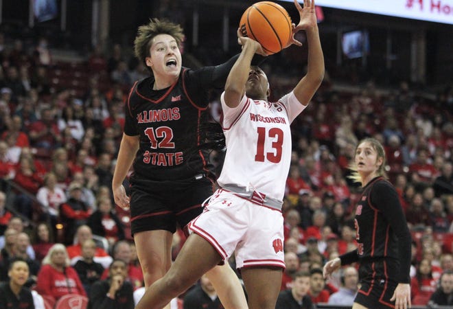 Illinois State's Maya Wong (12) blocks the shot of Wisconsin's Ronnie Porter (13) during a WNIT game at the Kohl Center in Madison, Wisconsin on Thursday March 28, 2024.