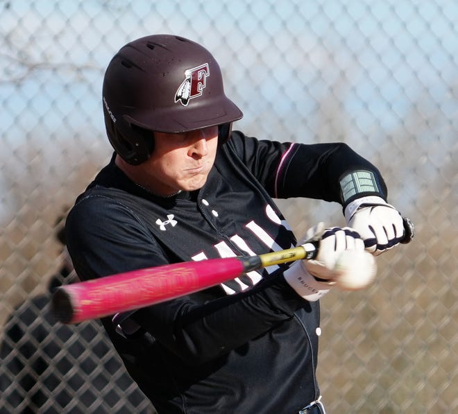 Menomonee Falls' Jack Ceplina (8) connects for a single to right during the game at Germantown, Friday, April 12, 2024.