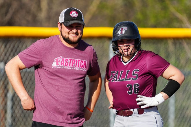 Menomonee Falls head coach Scott Eldredge chats with Brinn Kempf (36) after her triple in the game at Brookfield Central, Monday, April 15, 2024.