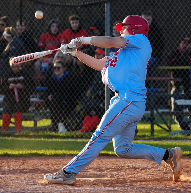 Slinger's Ethan Miller (22) connects for a pop fly during the game at Hartford, Thursday, April 25, 2024.