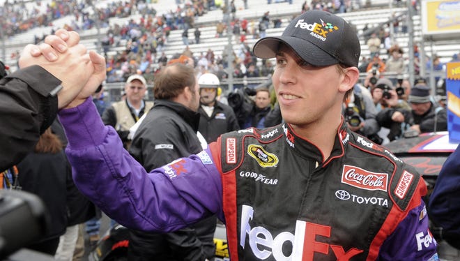 Denny Hamlin is congratulated after winning the Goody's Cool Orange 500 Cup race at Martinsville Speedway on March 30, 2008.