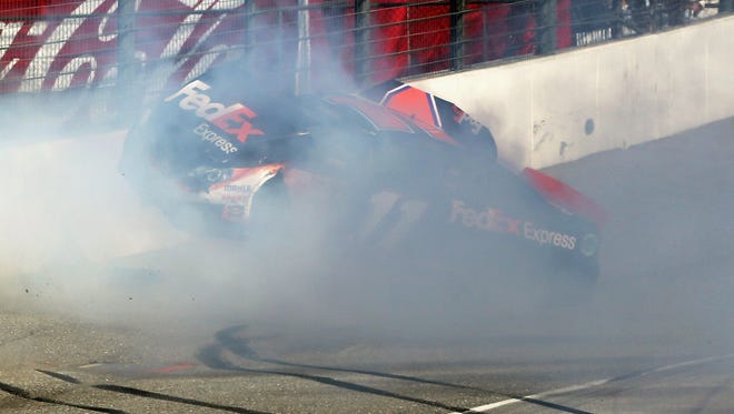 Denny Hamlin hits the wall after colliding with Joey Logano on the final lap of the Auto Club 400 at Fontana, Calif., on March 24, 2013.