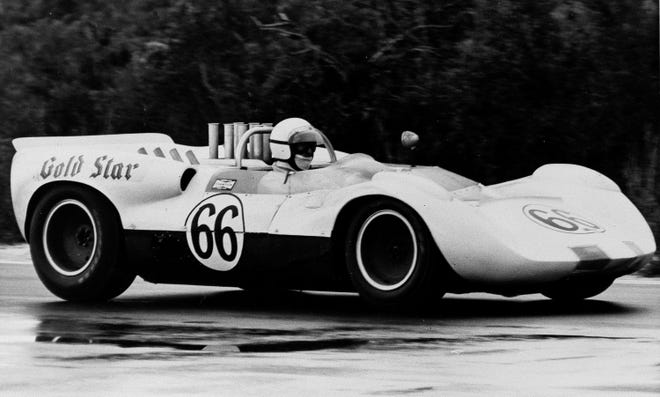 Roger Penske of Gladwyne, Pa., drives a borrowed Chaparral Chevrolet to victory in the 252-mile International Trophy race at Nassau, Bahamas, Dec. 7, 1964.