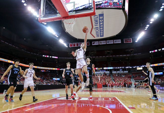 De Pere High School's John Kinziger (1) goes up for a layup against Arrowhead High School during the WIAA Division 1 boys basketball state championship game on Saturday, March 18, 2023, at the Kohl Center in Madison, Wis. De Pere won the game, 69-49, to finish the season a perfect 30-0.
Tork Mason/USA TODAY NETWORK-Wisconsin