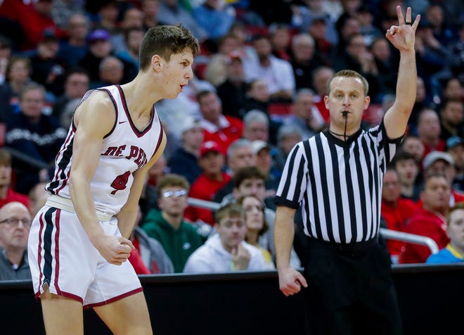 De Pere High School's Zach Kinziger (4) reacts after hitting a 3-pointer against Arrowhead High School during the WIAA Division 1 boys basketball state championship game on Saturday, March 18, 2023, at the Kohl Center in Madison, Wis. De Pere won the game, 69-49, to finish the season a perfect 30-0.
Tork Mason/USA TODAY NETWORK-Wisconsin