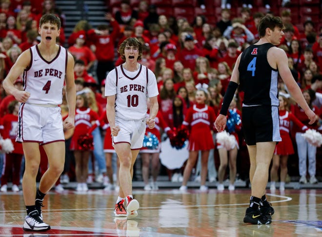 De Pere High School's Hogan Demovsky (10) celebrates as he heads to the bench for a timeout against Arrowhead High School during the WIAA Division 1 boys basketball state championship game on Saturday, March 18, 2023, at the Kohl Center in Madison, Wis. De Pere won the game, 69-49, to finish the season a perfect 30-0.
Tork Mason/USA TODAY NETWORK-Wisconsin