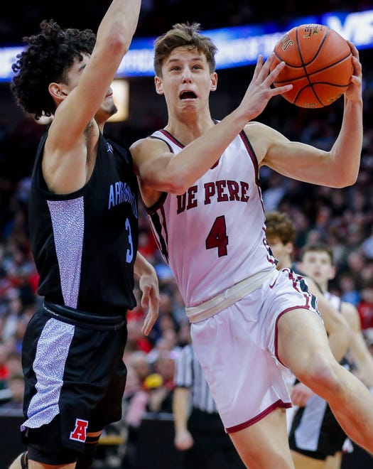 De Pere High School's Zach Kinziger (4) goes up for a layup against Arrowhead High School during the WIAA Division 1 boys basketball state championship game on Saturday, March 18, 2023, at the Kohl Center in Madison, Wis. De Pere won the game, 69-49, to finish the season a perfect 30-0.
Tork Mason/USA TODAY NETWORK-Wisconsin