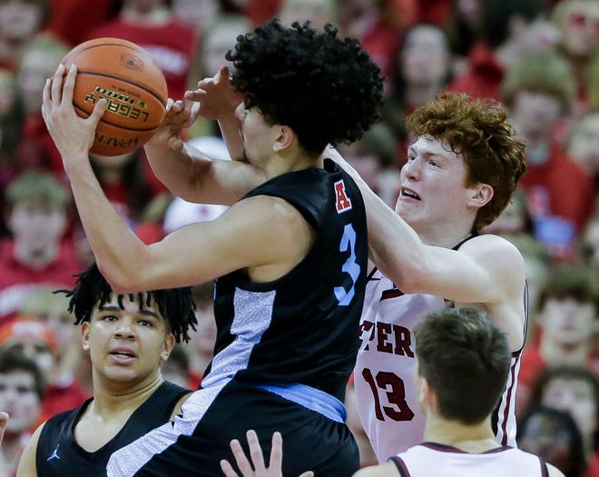 De Pere High School's Will Hornseth (13) and Arrowhead High School's Austin Villarreal (3) fight for a rebound during the WIAA Division 1 boys basketball state championship game on Saturday, March 18, 2023, at the Kohl Center in Madison, Wis. De Pere won the game, 69-49, to finish the season a perfect 30-0.
Tork Mason/USA TODAY NETWORK-Wisconsin