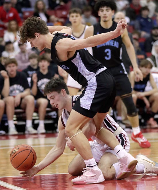 De Pere High School's John Kinziger (1) and Arrowhead High School's Alex Kramer (2) battle for a loose ball during their WIAA Division 1 state championship boys basketball game on Saturday, March 18, 2023 at the Kohl Center in Madison, Wis. De Dere won the game 69-49 to finish the season a perfect 30-0.
Wm. Glasheen USA TODAY NETWORK-Wisconsin