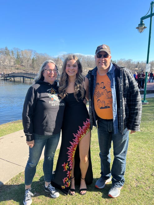 Hortonville High School junior Carolyn Tegge poses for a photo with her parents before heading off to prom on Saturday, April 13, 2024. The school held its prom at the Homestead Meadows Farm in Appleton.
