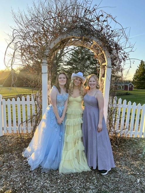 Hortonville High School students (from left) Adelyn Hoier, Jillian Miller and Abbie Hart pose for a prom photo on Saturday, April 13, 2024, at the Homestead Meadows Farm in Appleton.